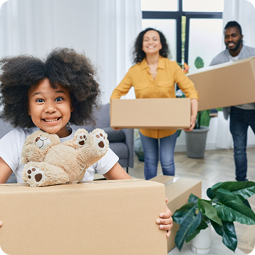 Family moving into a new home with boxes